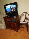 Nearly new flat screen tv and chair. The cabinet that the tv is on is good for storage of dvd's