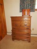 Newer maple chest with 5 deep drawers for storage.