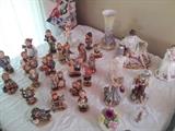 Hummels, many full bees in mint condition plus collectible porcelain figurines from other makers.
