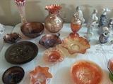 Carnival glass including rare pieces from Northwood, Imperial, Dugan, Fenton and Millersburg.