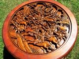 Closeup View of Vintage Oriental Style Hand Carved Round End Table with glass top (glass was removed to take this photo only)...carved camphor wood base with rich finish, and nicely turned legs