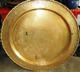 One of Two Vintage Oriental Style Brass  Table Tops... or use as a large Trays (likely circa 1940's) Has  intricate hand tooled designs around the outside border of the table top / tray.  This item is believed to be made in the Phillipines after the Japanese surrendered...from WW2 expended brass artillery shells