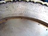 Close up of the workmanship for Vintage Oriental Style  Brass  Table Top... or large Tray (likely circa 1940's) Notice the  intricate hand tooled designs around the outside border of the table top / tray.  This item is believed to be made in the Phillipines after the Japanese surrendered...from WW2 expended brass artillery shells