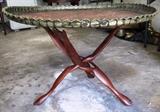 Vintage Oriental Style Brass Table with hand tooled brass top, and nicely carved mahogany base.  (Brass Table is likely circa 1940's) Has  intricate hand tooled designs around the table top / tray.  Brass table top is believed to be made in the Phillipines after the Japanese surrendered... from WW2 expended brass artillery shells