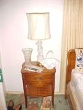other table and other lamp, there are some shoes and cowboy boots here as well