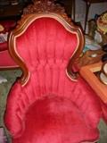 There are a pair of the lovely red chairs with the carved mahogany frame