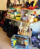 Games, A Hovercraft still in box, Skis and more fill the garage wall