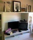 Great lamps, pictures and home decor atop the Entertainment Unit