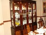 A view of the china cabinet and dining chairs plus Country Rose China.