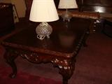 Highly carved, large coffee table and Waterford lamps