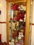 Lighted gold China Cabinet with glass shelves beautiful items inside. Each item is individually pictured to give you the best viewing experience.