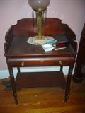 RARE CIRCA 1850 AMERICAN EMPIRE FLAME MAHOGANY COMMODE TABLE WITH ORIGINAL HARDWARE.