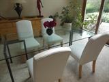 Crate Barrel Glass Dining Table with 4 white (need cleaning) side chairs