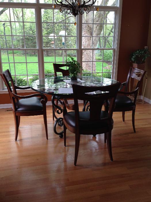 Large Beveled glass table with 4 wood/leather chairs with arms