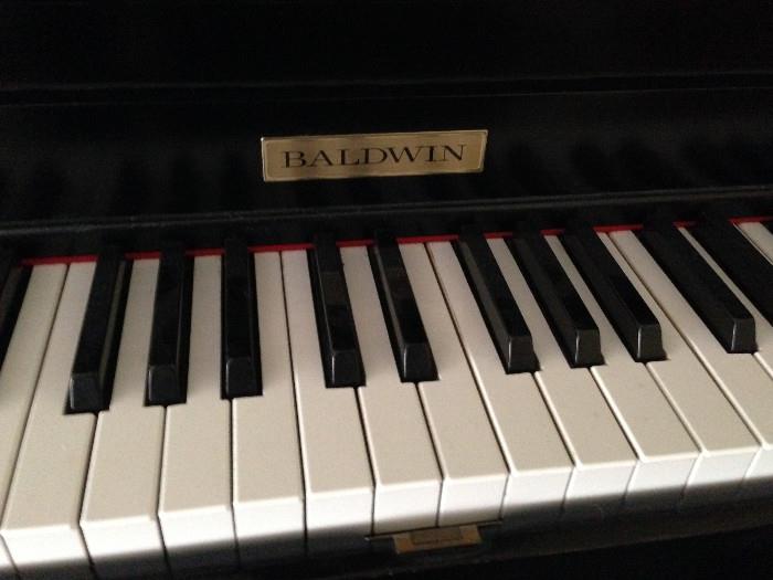 Baldwin Black lacquer upright Piano...excellent condition and sheet music included!