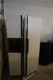 side by side refrigerator in good condition