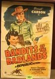 Lot#:	367
Description:	Vtg Movie Poster Bandits of Badlands Sunset Carson
Great vintage “The Bandits of the Badlands” western genre movie advertisement poster print from 1945. This lithograph poster was printed by Morgan Litho Corp., Cleveland, Ohio for Republic Pictures. The movie stars Sunset Carson with Peggy Stewart, Si “Rawhide” Jenks and John Merton; Directed by Thomas Carr, Original Screen Play by Doris Schroeder. It has a few condition issues; some creases and tearing at the folds but perhaps can be restored when framing. Held in a protective plastic sheath with a cardboard backing. Great for any theater room! Measures approx 27” wide x 41” high.
From the internet: “Republic Pictures was an American independent film production-distribution corporation with studio facilities, operating from 1935 through 1959, and was best known for specializing in westerns, movie serials and B films emphasizing mystery and action.
Tag Words: lobby card, artwork, art
Z14