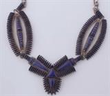 Lot#:	188
Description:	Jewelry Vintage Sterling Silver Lapis Necklace
Stunning vintage sterling silver necklace with Southwestern / Native American Indian style design. Featuring delicate petit point lapis lazuli stones. Necklace needs to be repaired. Exquisite detail! Measures: 26" long, marked / signed "DD". Total weight: 3.28 ozt. 