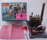 Lot#:	4
Description:	Vintage Wilesco Germany D 5 Steam Engine & Box
Highly collectible vintage toy replica steam engine with original box. Built by Wilesco in West Germany; this model D 5 features a true-to-life horizontal boiler with nickel silver finish and copperplate embossed brick type walls and chimney. Boiler and flywheel are mounted on a gray metal base and comes complete with original instructions, funnel and wrench! In excellent condition; appears to have rarely been used! Box has minor shelf wear and a hole where the valve poked through. Base plate measures approx 8” ” wide x 5.75” long.
Tag Words: toys, hobby, hobbies