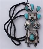 Lot#:	1
Description:	Jewelry HUGE Sterling Silver Kachina Bolo Tie
Amazing huge sterling silver bolo tie with Southwestern / Native American Indian style design. Bolo is shaped like a kachina figure. Featuring several large blue turquoise stones and polished red coral for the eyes. Intricate detail! Bolo measures: 5.5" long x 2.25" wide and hangs on braided leather ties. Missing tips. Marked / signed "S.P.". Total weight: 2.80 ozt. 