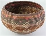 Lot#:	396
Description:	Vintage Native American Indian Poly Basket / Olla
Great vintage authentic Southwest style Native American Indian hand woven poly basket. Unknown origin, possibly Pima or California Native American? It features an intricate coiled design with polychrome pattern of checkerboards and circle in circle with a unique plaited bottom. In excellent vintage pre-owned condition with bright coloring! Measures approx., 7.5” tall x 10.5” in diameter.
Tag Words: Southwestern, polychrome