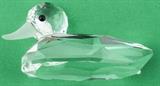 Lot#:	98
Description:	Retired Swarovski Crystal Mallard Duck Figurine
Glimmering Swarovski Austrian Crystal “Mallard Duck” Variation 1 figurine. Designed by Max Schreck and created for the “Beauties of the Lake” series; it was released in 1986, and retired in 1994. Model number # 7647 NR 80, it has a large multi-faceted body and adorned with black crystal gem eyes and a frosted crystal beak. Etched with the Swarovski “Block” signature logo, it is in mint condition, with no chips, cracks, repairs or missing parts. Missing its original box; it sits beautifully atop an octagon shaped mirror to reflect its light beautifully! Measures 1.75" tall x 3.5" long.
Tag Words: Austria 