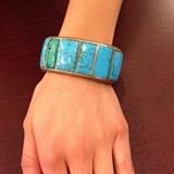 Several Similar: http://azfirearms.auctionflex.com/showlots.ap?co=10355&weid=42637&weiid=0&keyword=cuff&lso=lotnumasc&pagenum=1&lang=En        Lot#:	298
Description:	Jewelry Sterling Silver Turquoise Cuff Bracelet
Stately large sterling silver cuff bracelet with Southwestern / Native American Indian style design. Featuring six turquoise stones, band is accented with twisted rope metal work designs. Unmarked, consignor states this piece is sterling. Measures: 5.5" around with 1.5" opening. Total weight: 2.34 ozt. 