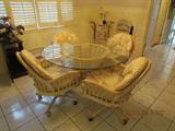 Glass Top Rattan Round Table w/ 4 Rolling Chairs.