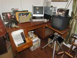 Large Solid Oak Library Desk w/ typewriter slide-out. Sony TV. HP Computer w/ two key boards. Camera Stand.