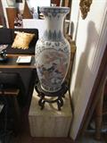 Large Oriental Urn on wood display stand. Marble Rolling Display Stand.