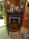 Beautiful 1920's  Leather Top, Round Coffee Table. Faux Corner Fireplace. Old, real Glove Molds. Metal South American Plate. Antique Wine Dispenser, rare. Small Gold framed Mirror. Aztec Calendar Clock.