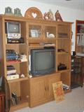 Entertainment Center. Sony TV. Converter Box. SR Stereo Cassette-Recorder. Bearcat 20-20 40 Channel Crystalles Scanner Aircraft-Marine-Public Service. Small Samsung TV. Sony VHS Player. Bibles. Vintage RCA Victor Record Player. Sears Cassette AM/FM Radio Recorder.