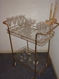Brass & Glass Rolling Tea Cart with some crystal.