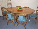 1970's Oak Round Table with two leaves and six chairs. Two armed chairs and four regular. Nice retro look.