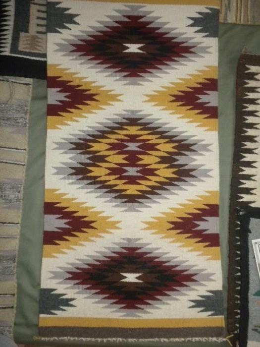 Pretty Navajo wall hanging rugs!