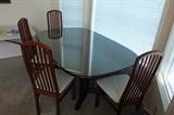 Italian Rosewood Table w/ six chairs & glass top + two leafs.  $275.00