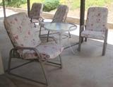 Six light weight patio chairs; two tables