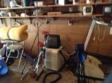 old highchair, small tv, travel stroller, older model treadmill