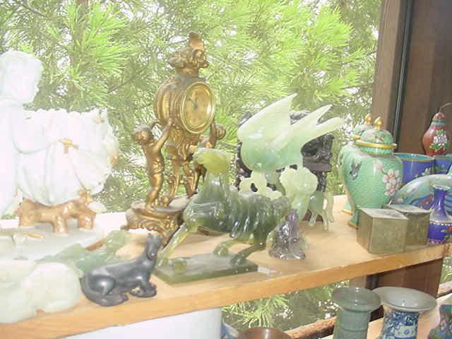 Large selection of vintage jade, soapstone, and ironstone carved figures 