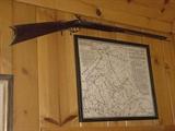 Old Civil War rifle and one of the several old maps