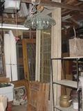 This is a pair of 10' stained glass doors from an Alabama hotel, and are on floor rollers, 