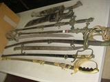 Some of the many swords, daggers and bayonets