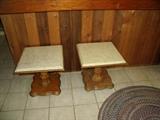 Small pedestal tables with marble tops