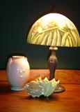 New lamp with reverse-painted shade.  Roseville and McCoy pottery pieces are scattered throughout the house.