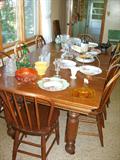 Oak table, several leaves, with 8 side chairs, early 1900's