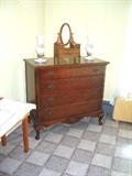 Chest of drawers from the bedroom suite mentioned previously. Child's or doll's furniture piece on top.