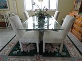 72 x 42 Glass Top Table with Dolphin Base, and six chairs