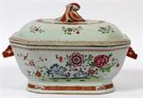 Lot#1016, CHINESE EXPORT FAMILLE ROSE TUREEN, 18TH C., H 6", L 14"Rectangular porcelain tureen with chamfered corners and conforming cover, flanked by boar's head handles, and decorated with floral branches and sprays.  Measures H.8 7/8" x 14" (to the handles) x 8 7/8".