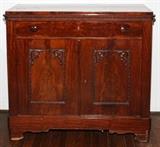 Lot#1059, AMERICAN MAHOGANY SIDEBOARD, C. 1870, H 39", W 40", D 15"With two cupboard doors under one drawer. Circa 1870. Bracket feet. Original drawer pulls.