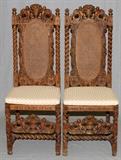 Lot#1063, ITALIAN CARVED OAK SIDE CHAIRS, PAIR/Carved cherubs holding on to fully carved floral urn crest with scrolling leaf design.  Turned barley twist columns centered by oval caned back panel and seat.  Loose cushion.